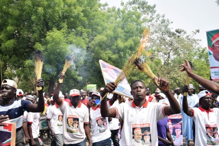 PHOTOS: Supreme Court: PDP supporters burn brooms in Abuja