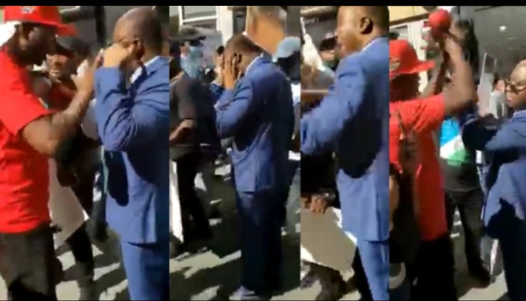 Nigerian Protesters Slap Top Government Official In US For Meddling In Anti-Buhari Protests [Photo]